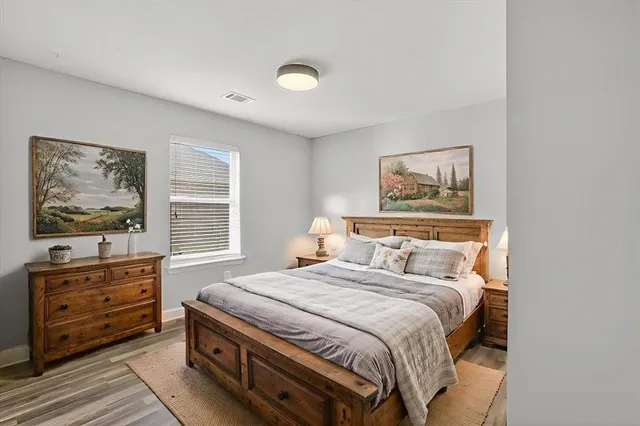 a bedroom with a bed and a window in it