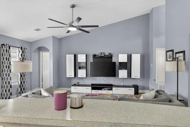 a kitchen with a stove and a white cabinets