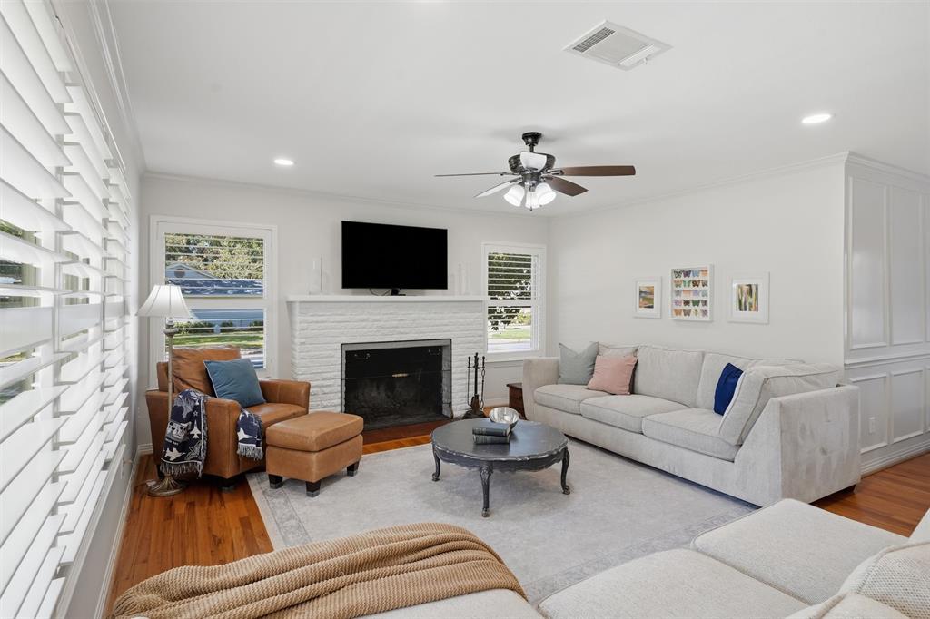 3712 Brighton Road Fort Worth, TX 76109 - Photo 7 of 33 Living room featuring beautiful white fireplace perfect for family gatherings.
