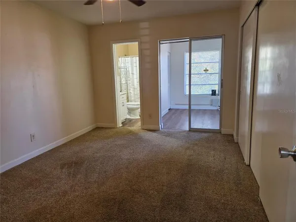 an empty room with closet area