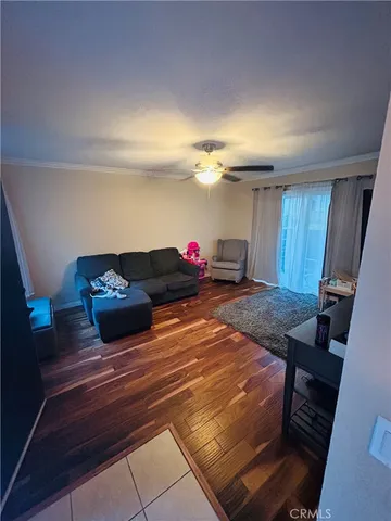 a living room with furniture and a rug