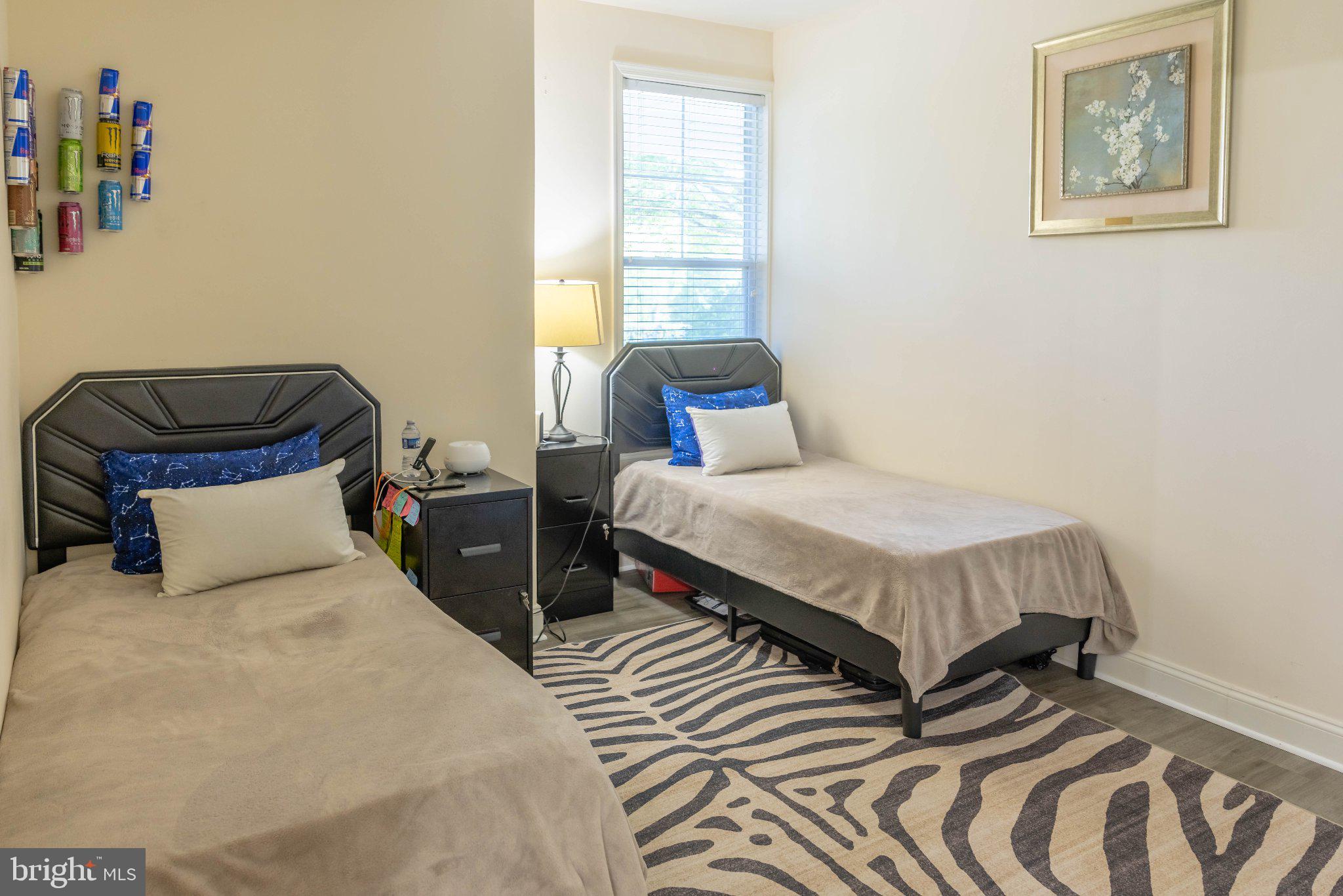 12824 Clarksburg Square Road, Unit 105 Clarksburg, MD 20871 - Photo 68 of 96 Cozy twin bedroom with modern flair.