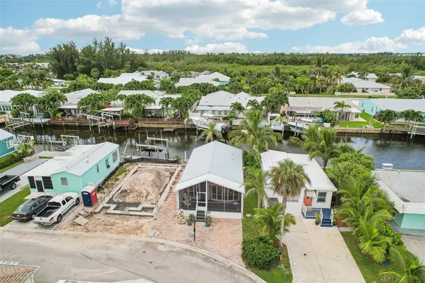 an aerial view of a house with lake view