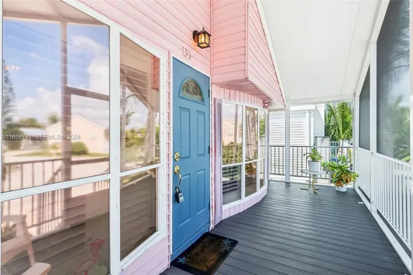 a view of a balcony with wooden floor