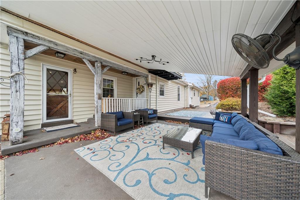 1512 Abers Creek Road Pittsburgh, PA 15239 - Photo 33 of 39 a view of a patio with couches chairs and potted plants