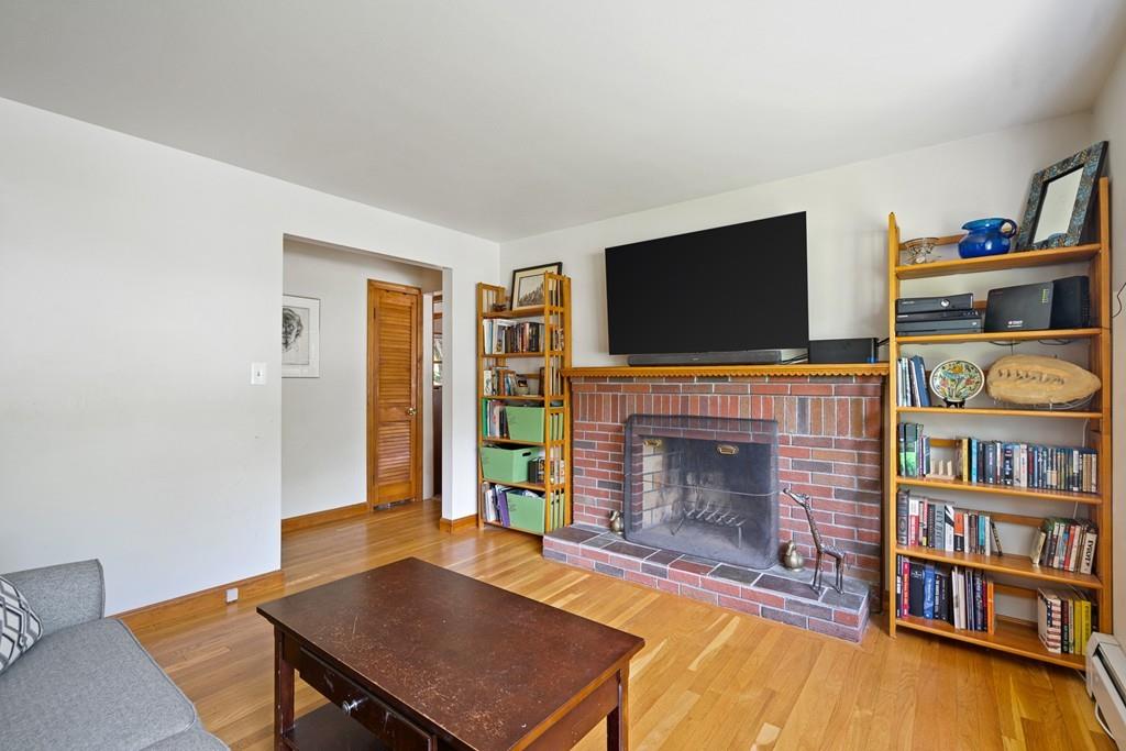 5 Shasta Drive Lancaster, MA 01523 - Photo 3 of 29 a living room with fireplace and a wooden floor