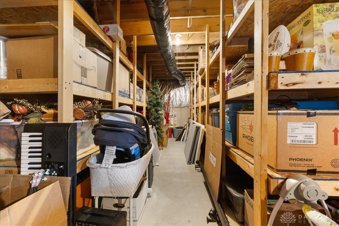 841 Willow Road Springfield, OH 45502 - Photo 38 of 64 This basement offers ample storage solutions with extensive shelving and practical organization.
