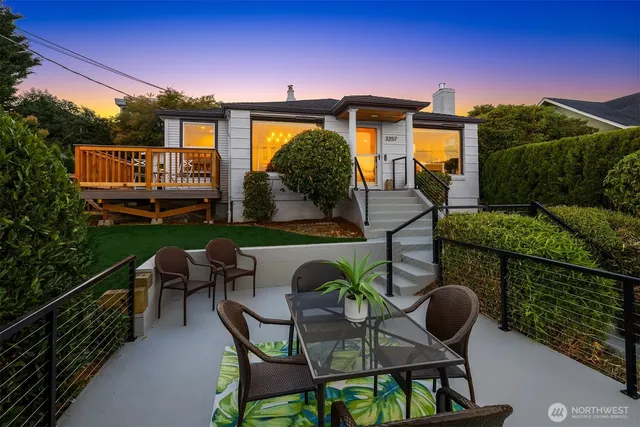 a view of a chairs and table in patio