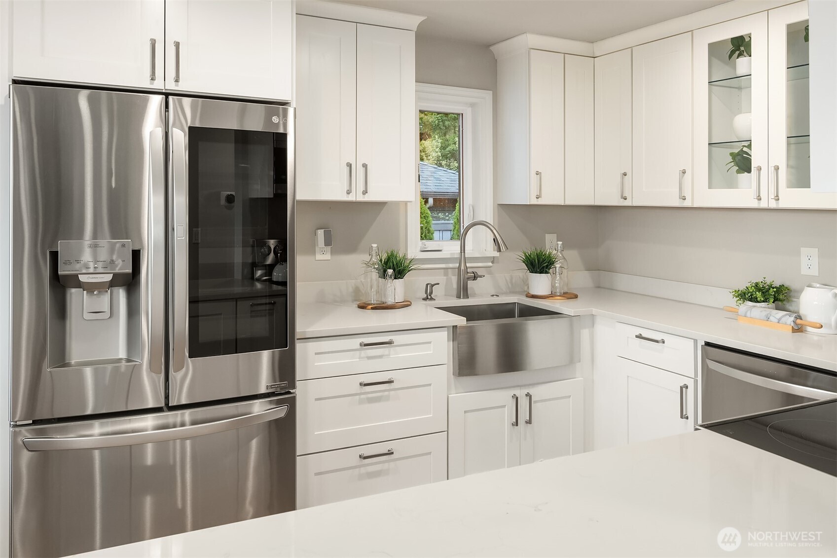 3257 37th Avenue Southwest Seattle, WA 98126 - Photo 11 of 40 a kitchen with white cabinets and refrigerator
