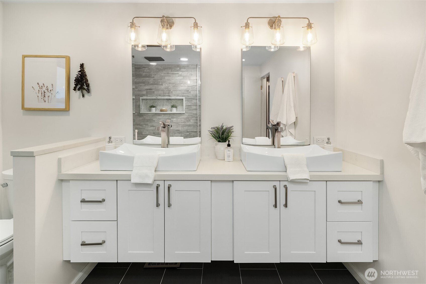 3257 37th Avenue Southwest Seattle, WA 98126 - Photo 22 of 40 a bathroom with a sink and a mirror