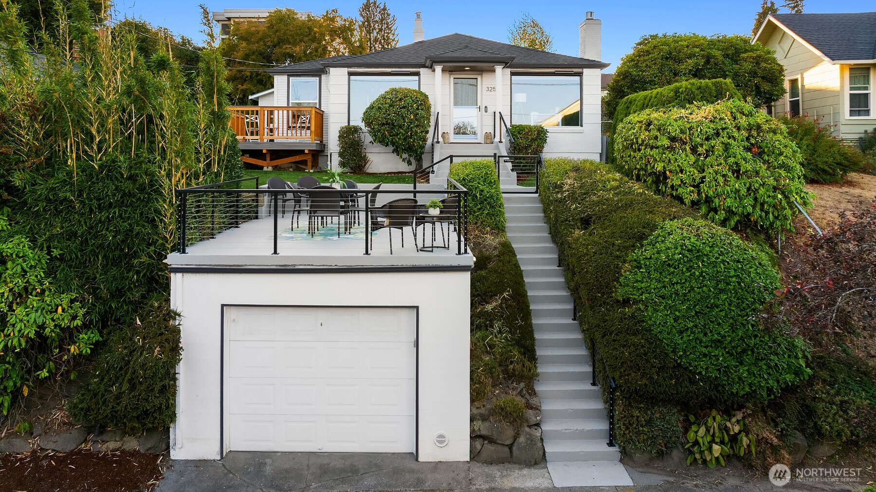 3257 37th Avenue Southwest Seattle, WA 98126 - Photo 33 of 40 a front view of a house with garden