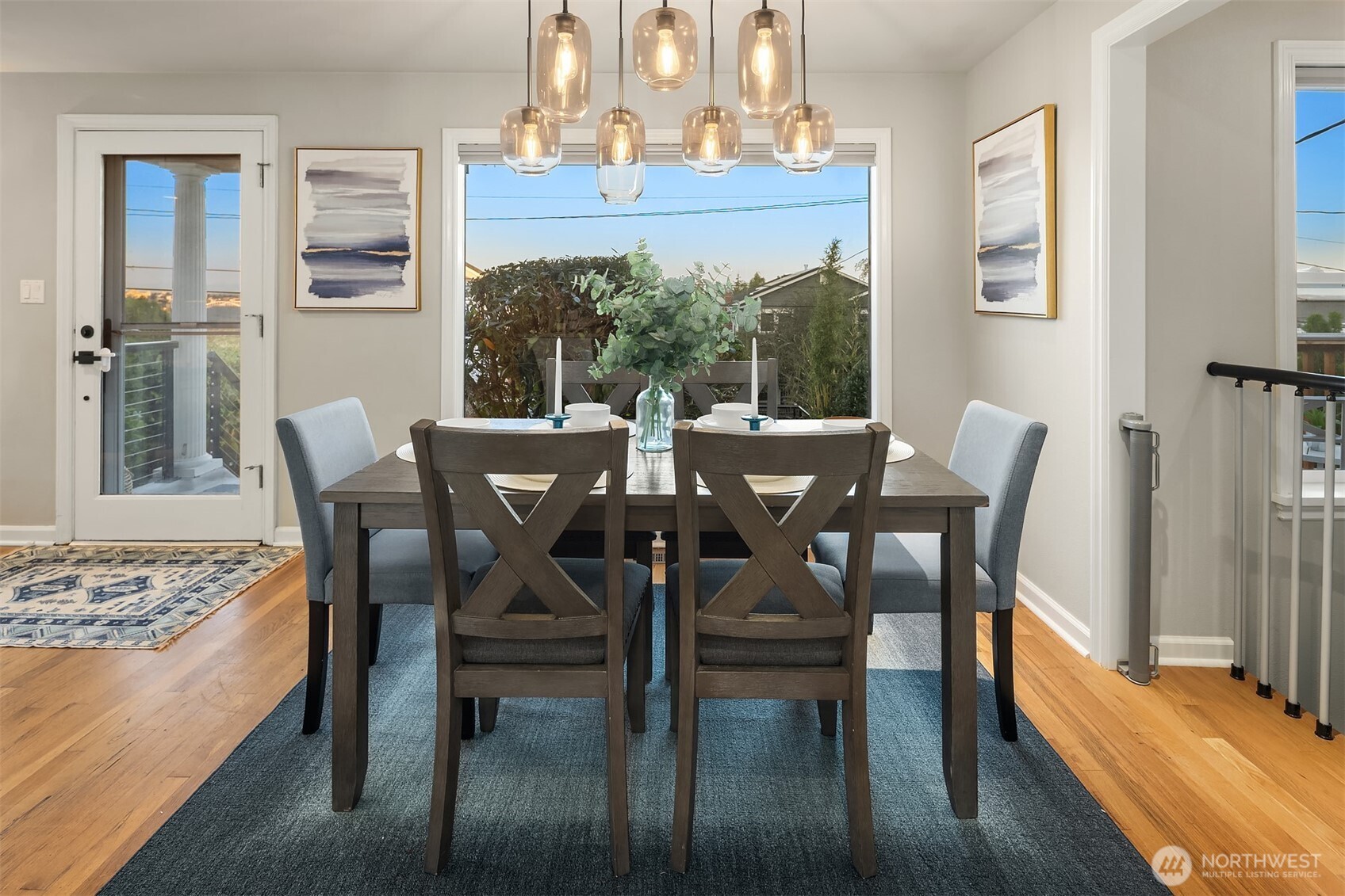 3257 37th Avenue Southwest Seattle, WA 98126 - Photo 9 of 40 a view of a dining room with furniture window and wooden floor