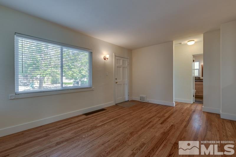608 Cheney Street Reno, NV 89502 - Photo 4 of 22 a view of a room with wooden floor and window