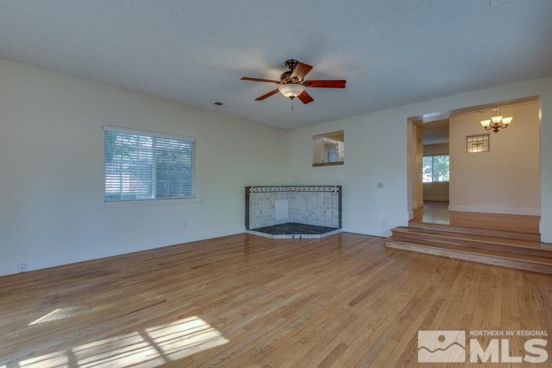 608 Cheney Street Reno, NV 89502 - Photo 10 of 22 a view of empty room with wooden floor and fan