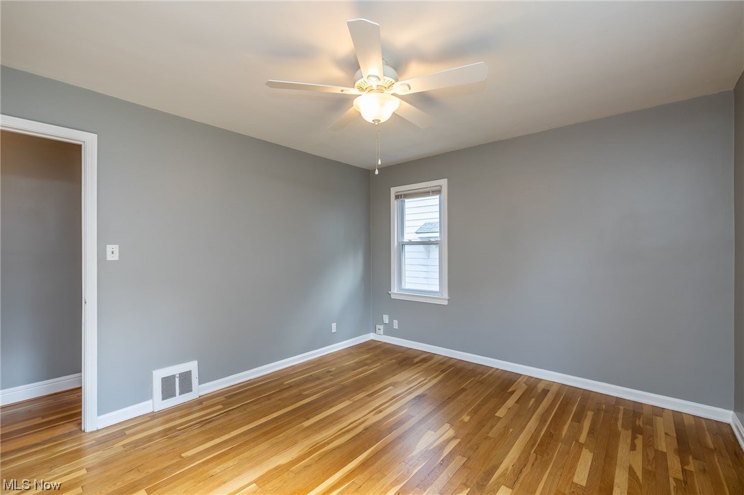 4979 South Barton Road Cleveland, OH 44124 - Photo 15 of 25 Bedroom #2 features HW floors and ceiling fan