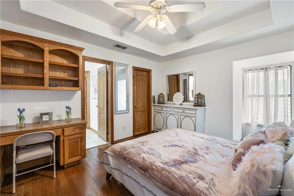 8413 North Main Street McAllen, TX 78504 - Photo 17 of 37 a bedroom with a bed and a desk