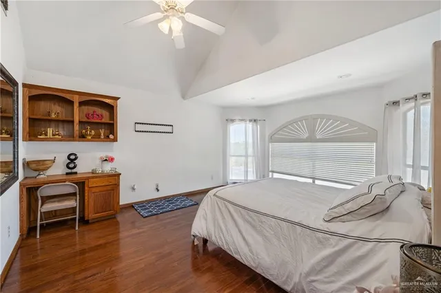 a bedroom with a bed and a desk