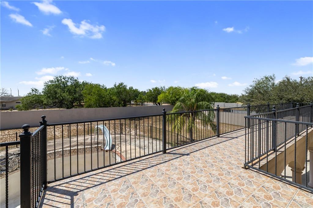 8413 North Main Street McAllen, TX 78504 - Photo 27 of 37 a balcony with trees in the background
