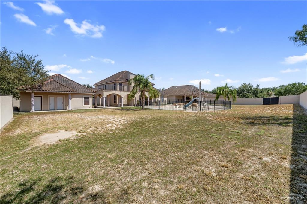 8413 North Main Street McAllen, TX 78504 - Photo 31 of 37 a front view of a house with a yard