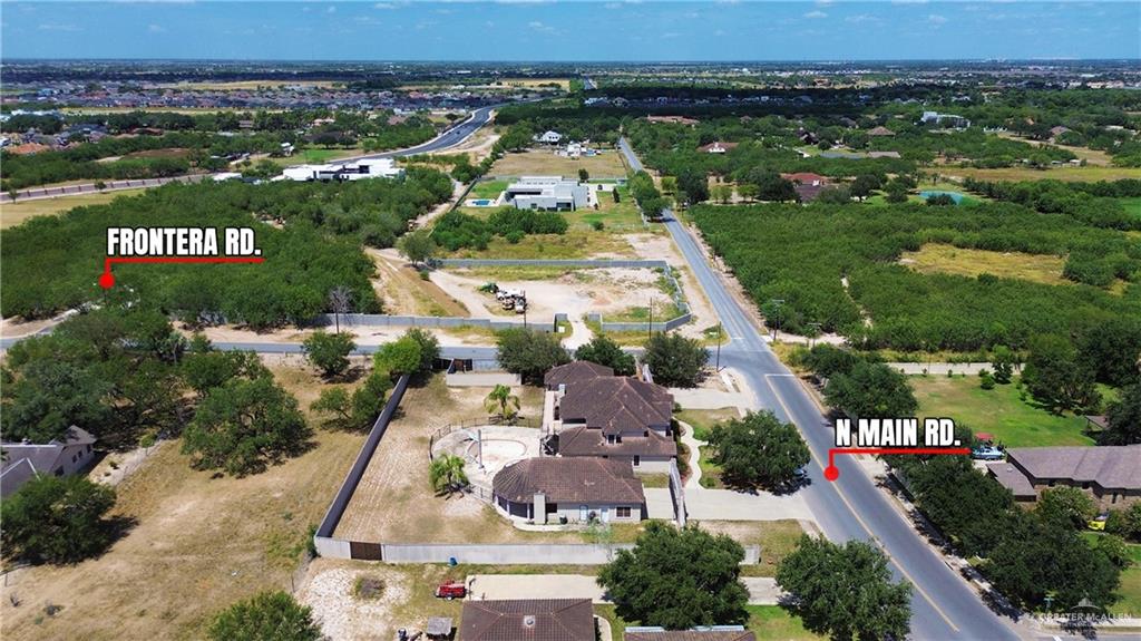 8413 North Main Street McAllen, TX 78504 - Photo 34 of 37 an aerial view of residential houses with outdoor space and parking