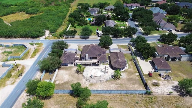 an aerial view of a house with outdoor space