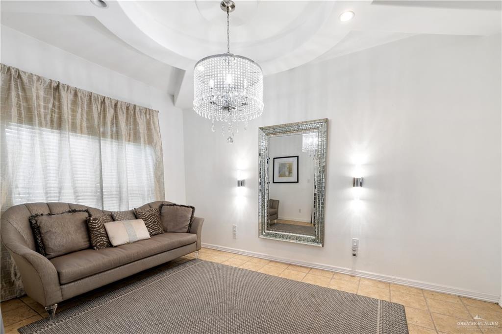 8413 North Main Street McAllen, TX 78504 - Photo 5 of 37 a living room with furniture and a chandelier