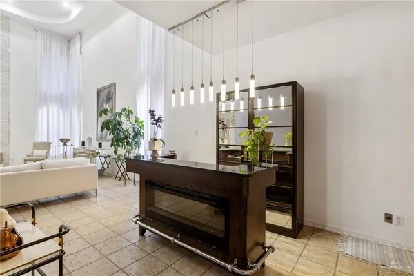 a dining room with furniture and chandelier