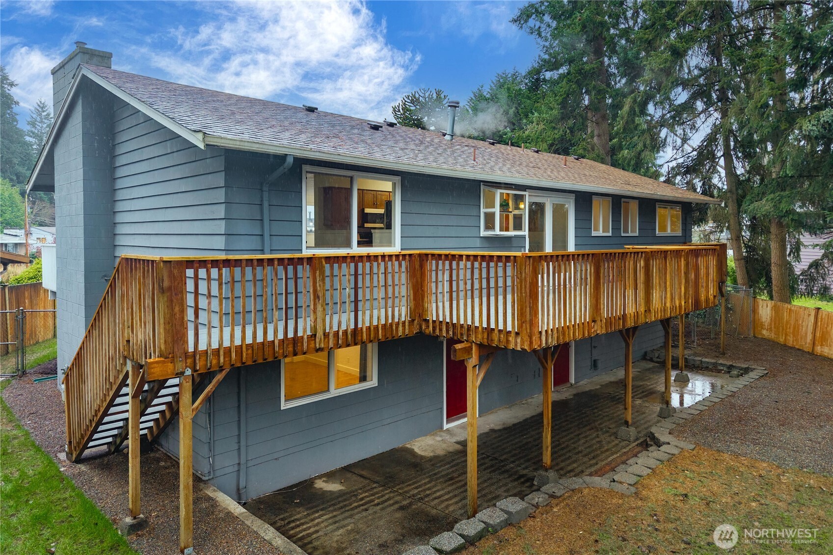 114 Southwest 313th Street Federal Way, WA 98023 - Photo 37 of 40 a view of a house with a wooden deck
