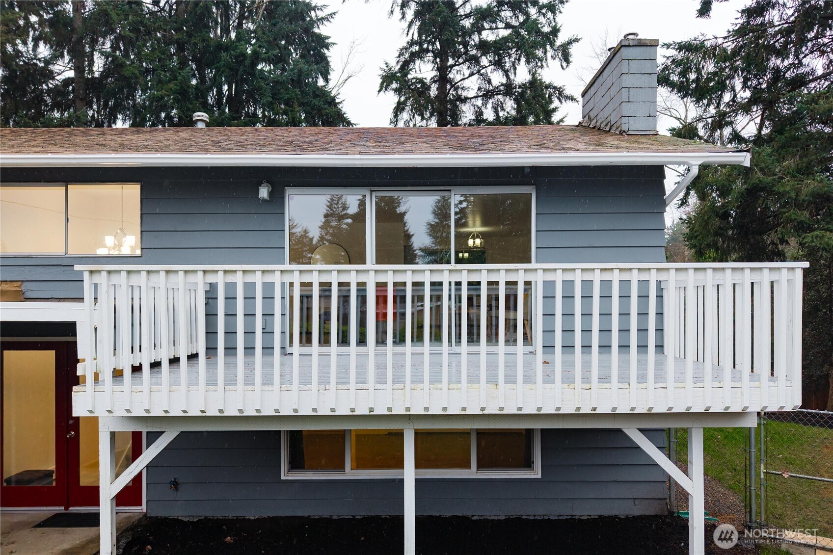 114 Southwest 313th Street Federal Way, WA 98023 - Photo 38 of 40 a view of a house with a wooden deck