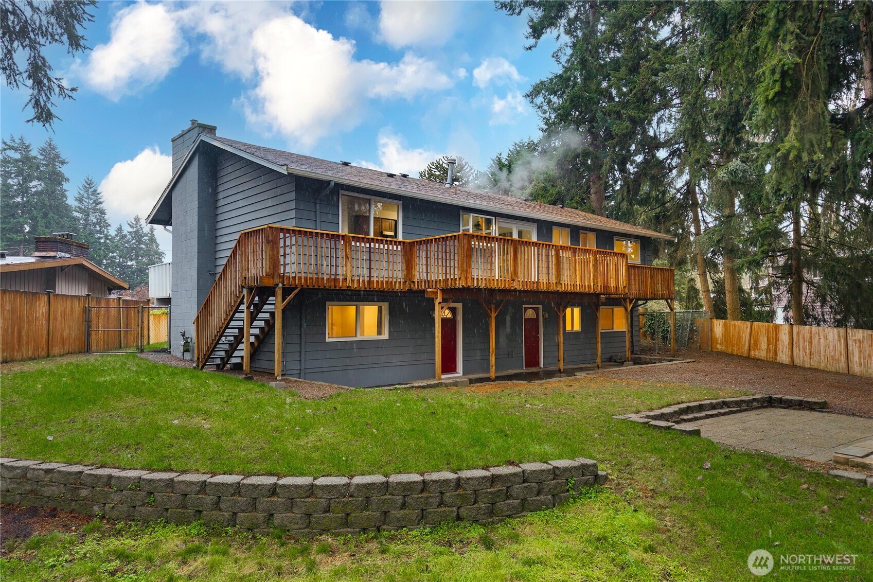 114 Southwest 313th Street Federal Way, WA 98023 - Photo 4 of 40 a view of a house with a yard and a porch