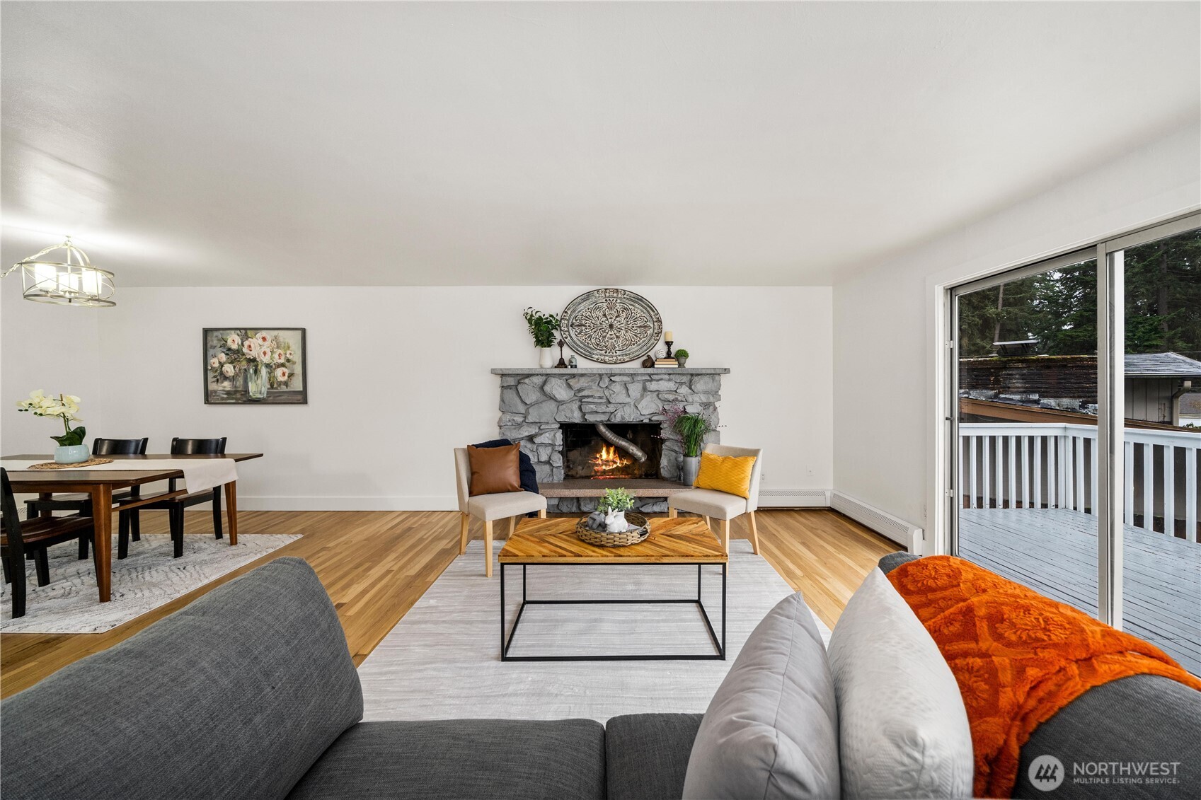 114 Southwest 313th Street Federal Way, WA 98023 - Photo 7 of 40 a living room with furniture a fireplace and a table