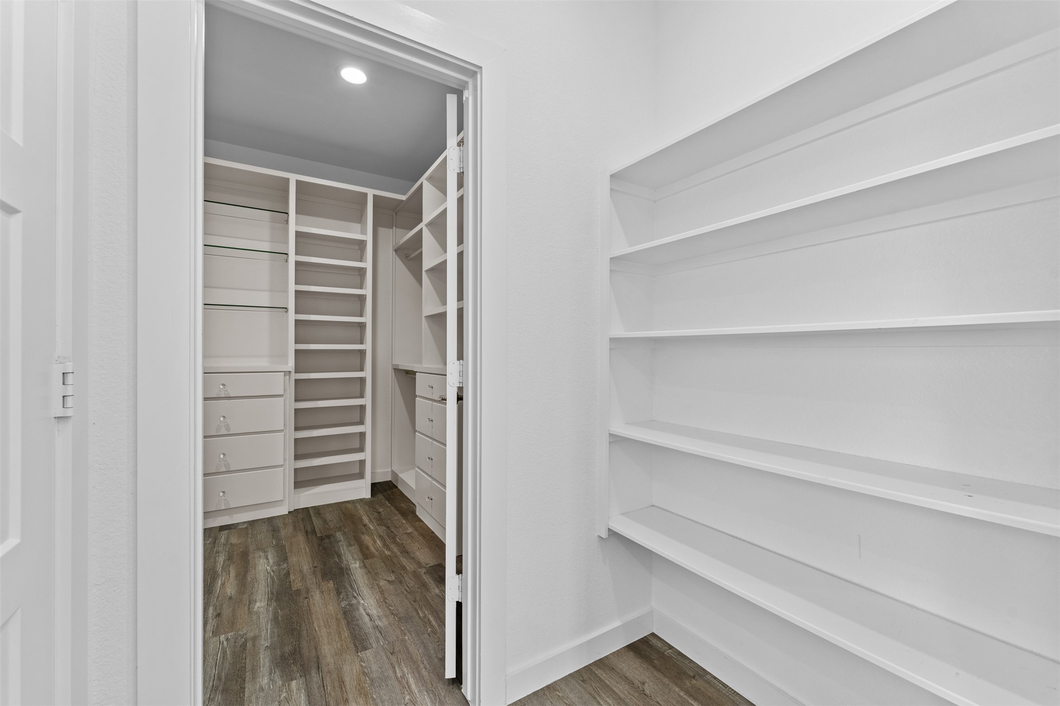 22503 Modica Rift Lane Katy, TX 77449 - Photo 17 of 47 a view of walk in closet with empty racks