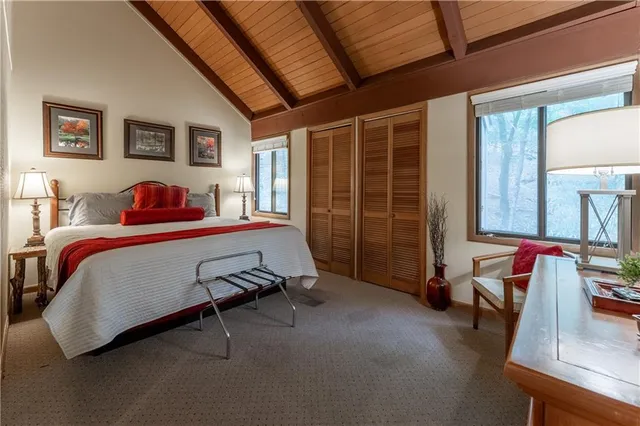 a bedroom with furniture and a window