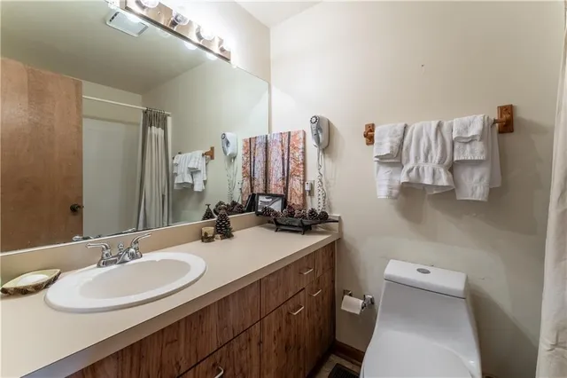 a bathroom with a sink double vanity and a mirror