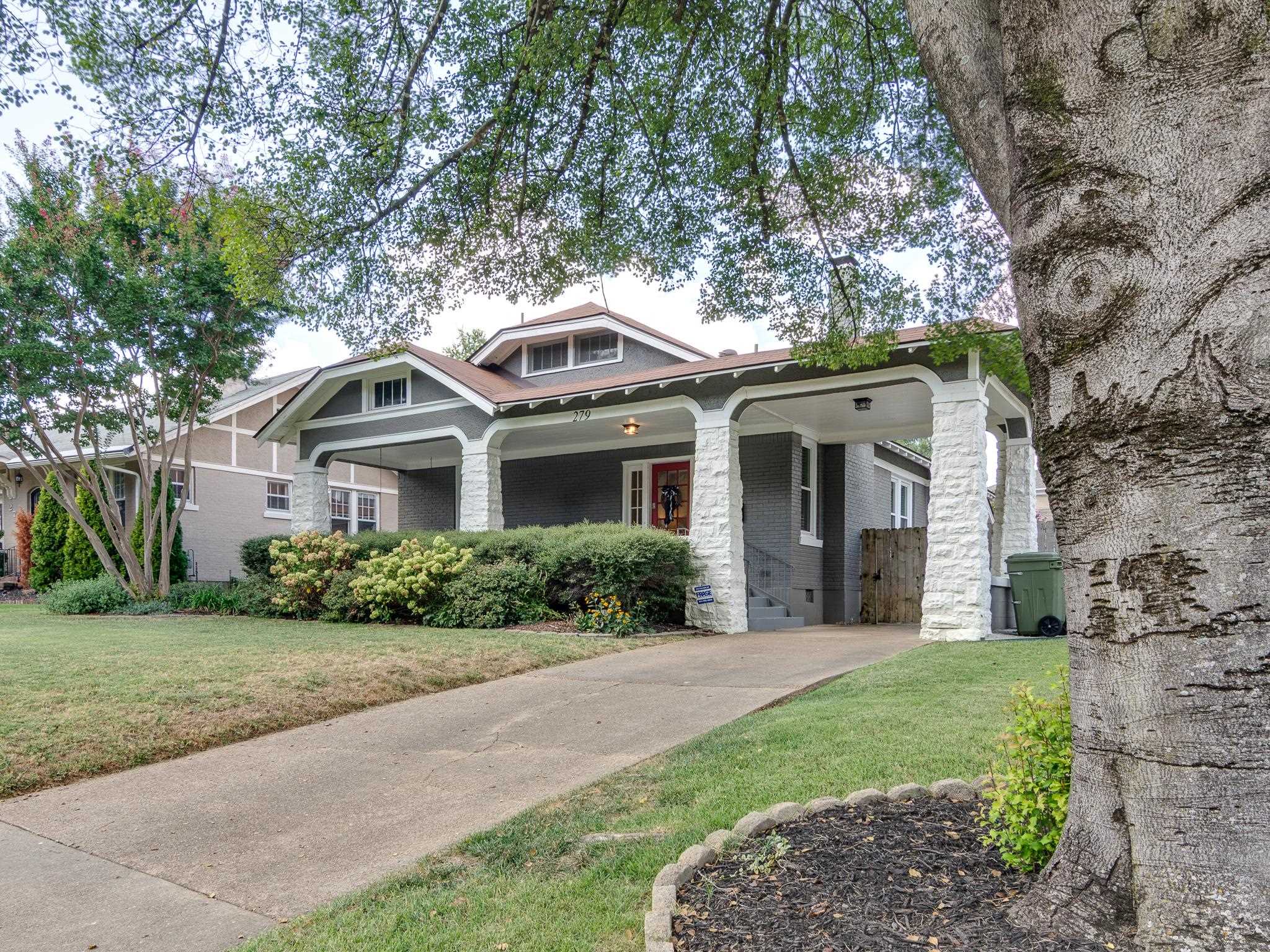 279 Angelus Street Memphis, TN 38112 - Photo 2 of 34 a front view of a house with garden