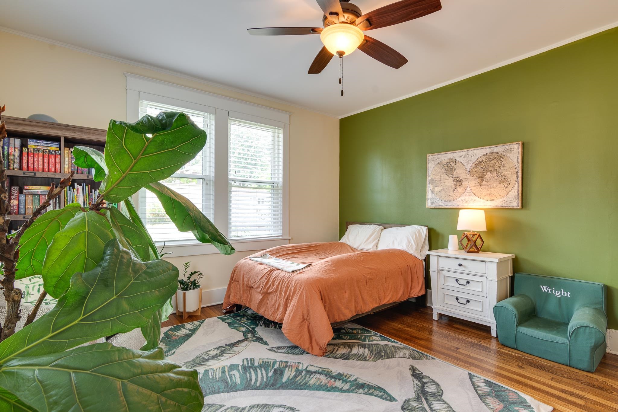 279 Angelus Street Memphis, TN 38112 - Photo 25 of 34 a bedroom with a bed and a chandelier