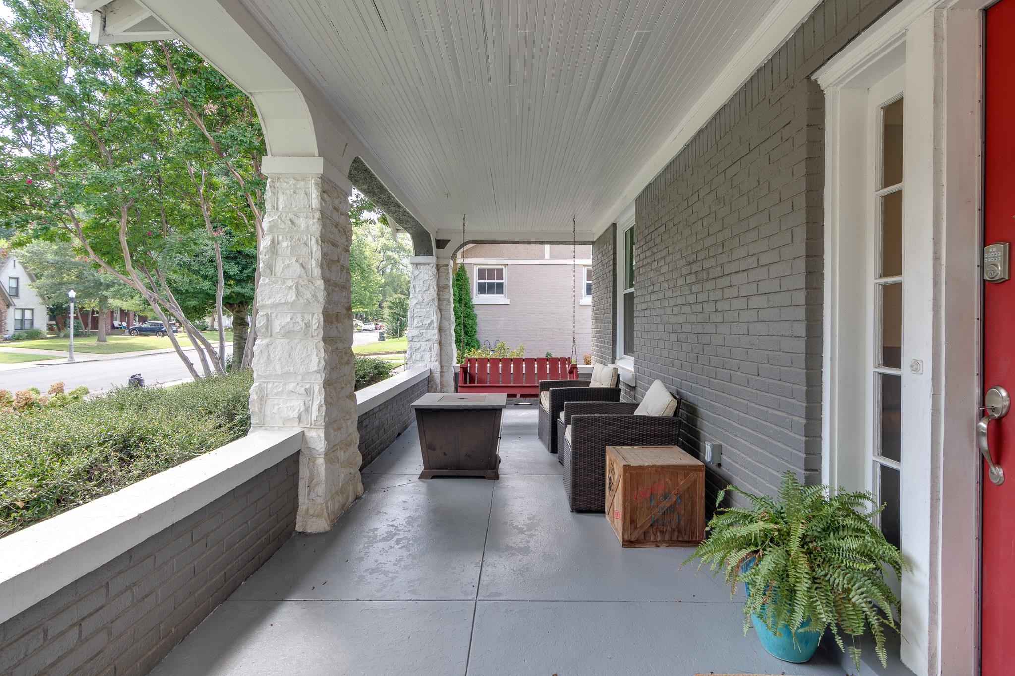 279 Angelus Street Memphis, TN 38112 - Photo 4 of 34 a view of a patio with chairs and a potted plant