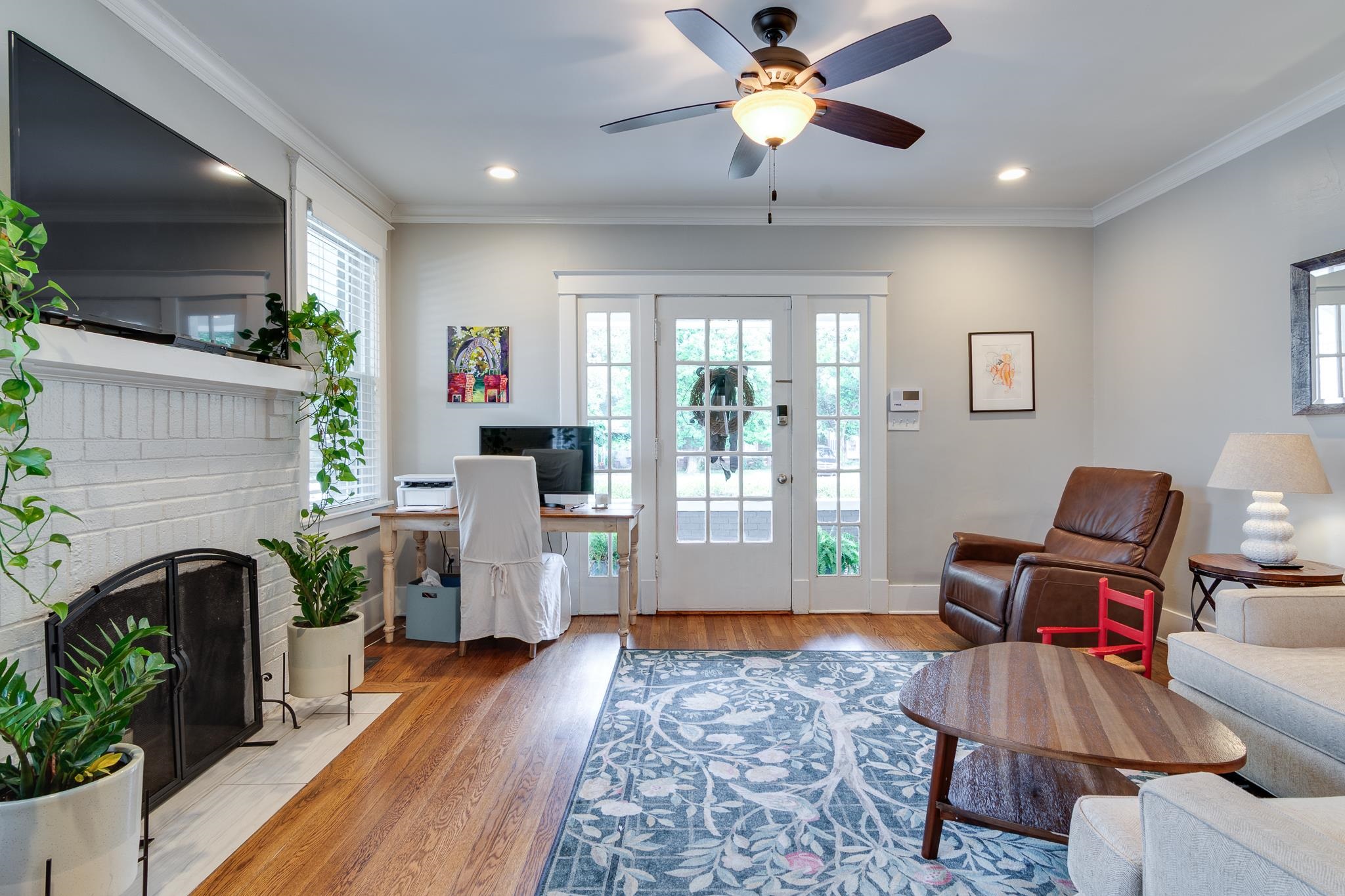 279 Angelus Street Memphis, TN 38112 - Photo 6 of 34 a living room with furniture and a fireplace