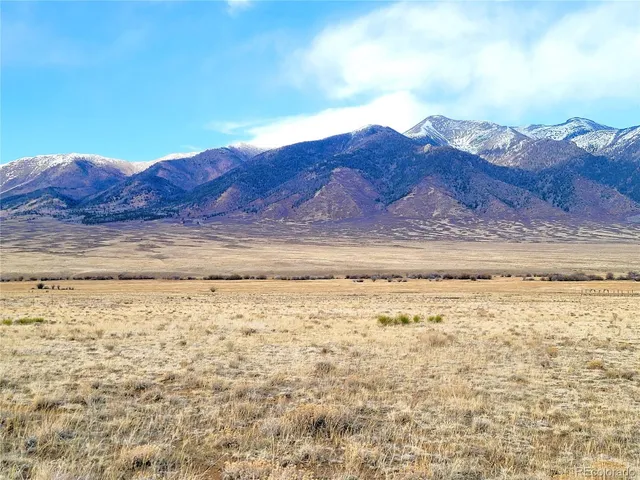 a view of ocean with mountains in the background