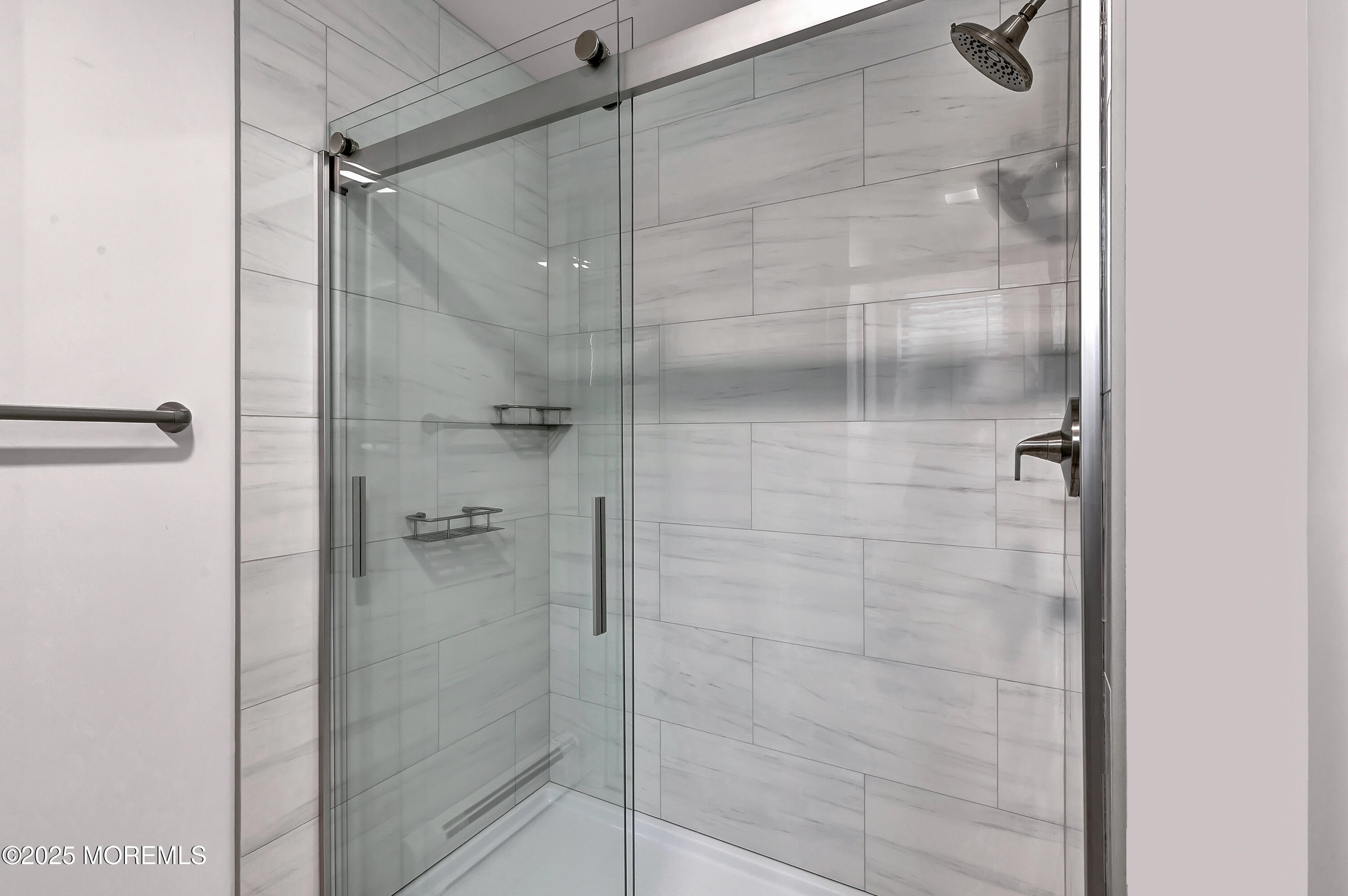 370 East Main Street Manasquan, NJ 08736 - Photo 20 of 34 a bathroom with a glass shower door