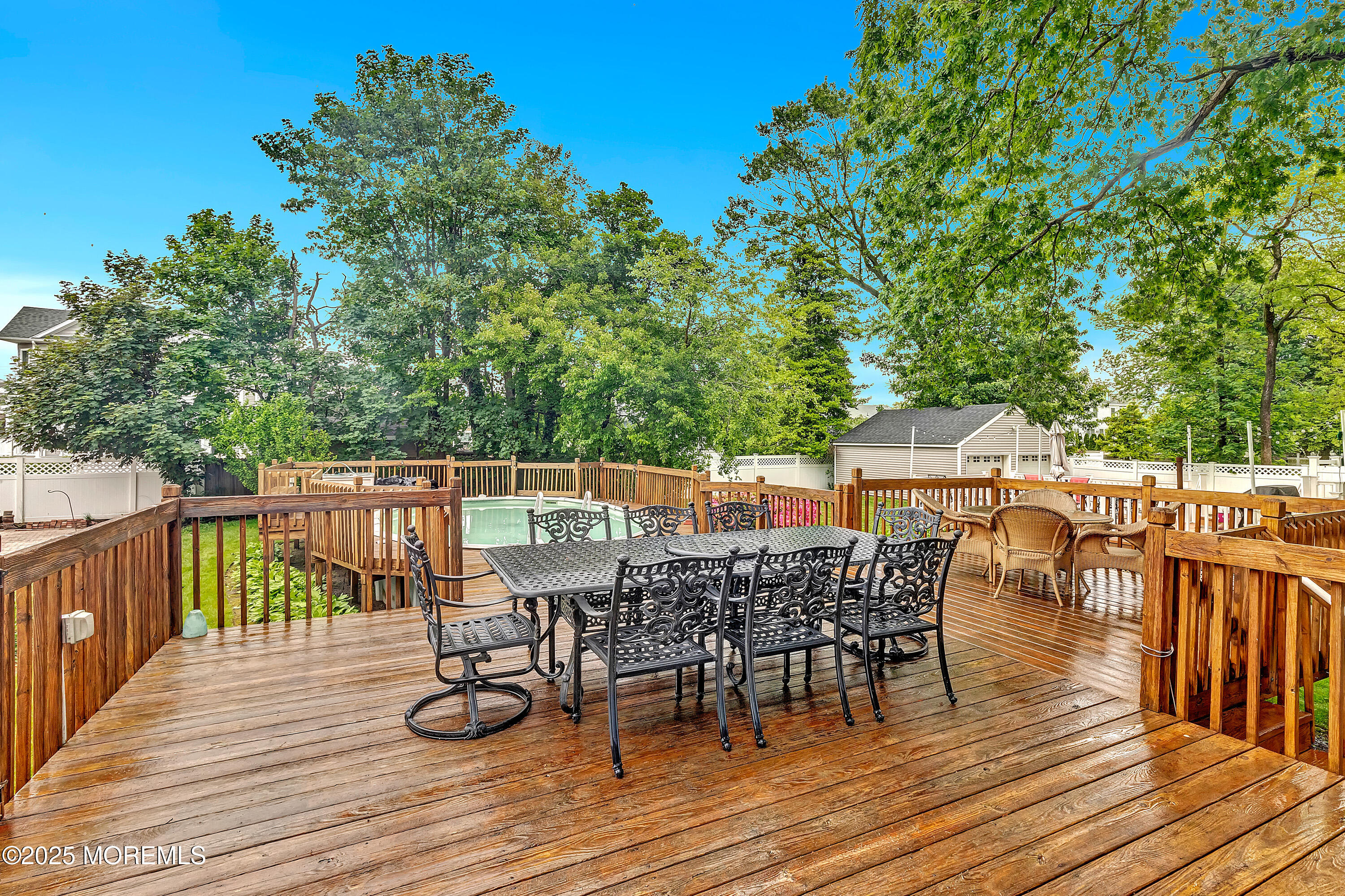 370 East Main Street Manasquan, NJ 08736 - Photo 24 of 34 a balcony with wooden floor table and chairs