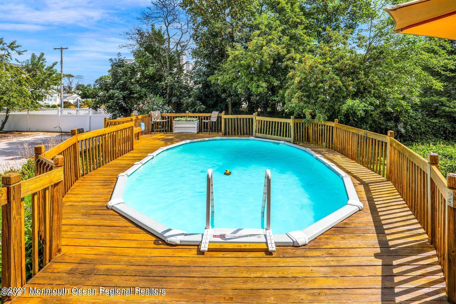 370 East Main Street Manasquan, NJ 08736 - Photo 26 of 34 a view of a swimming pool with a lounge chairs