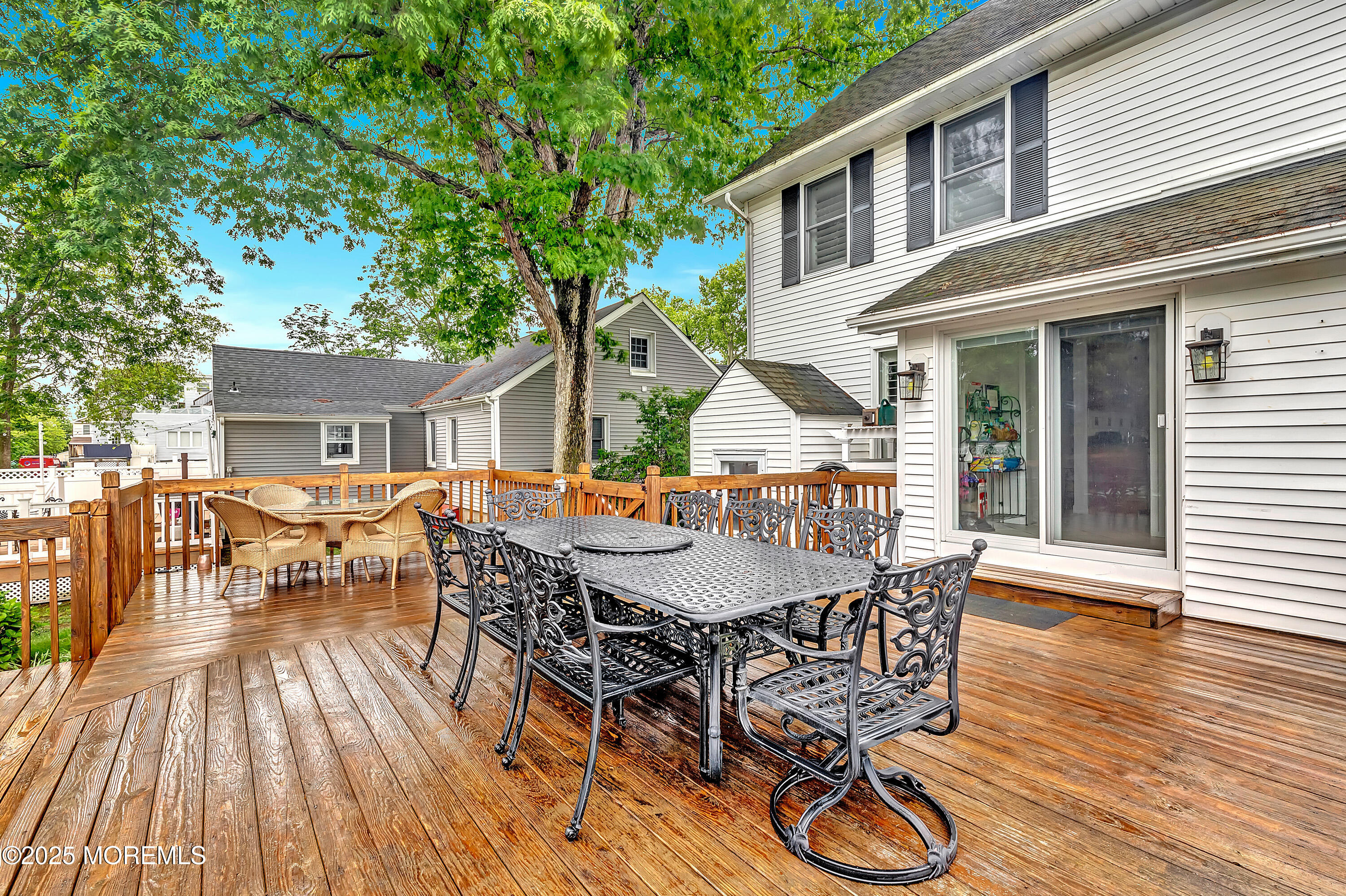 370 East Main Street Manasquan, NJ 08736 - Photo 6 of 34 a view of a patio with table and chairs and wooden floor