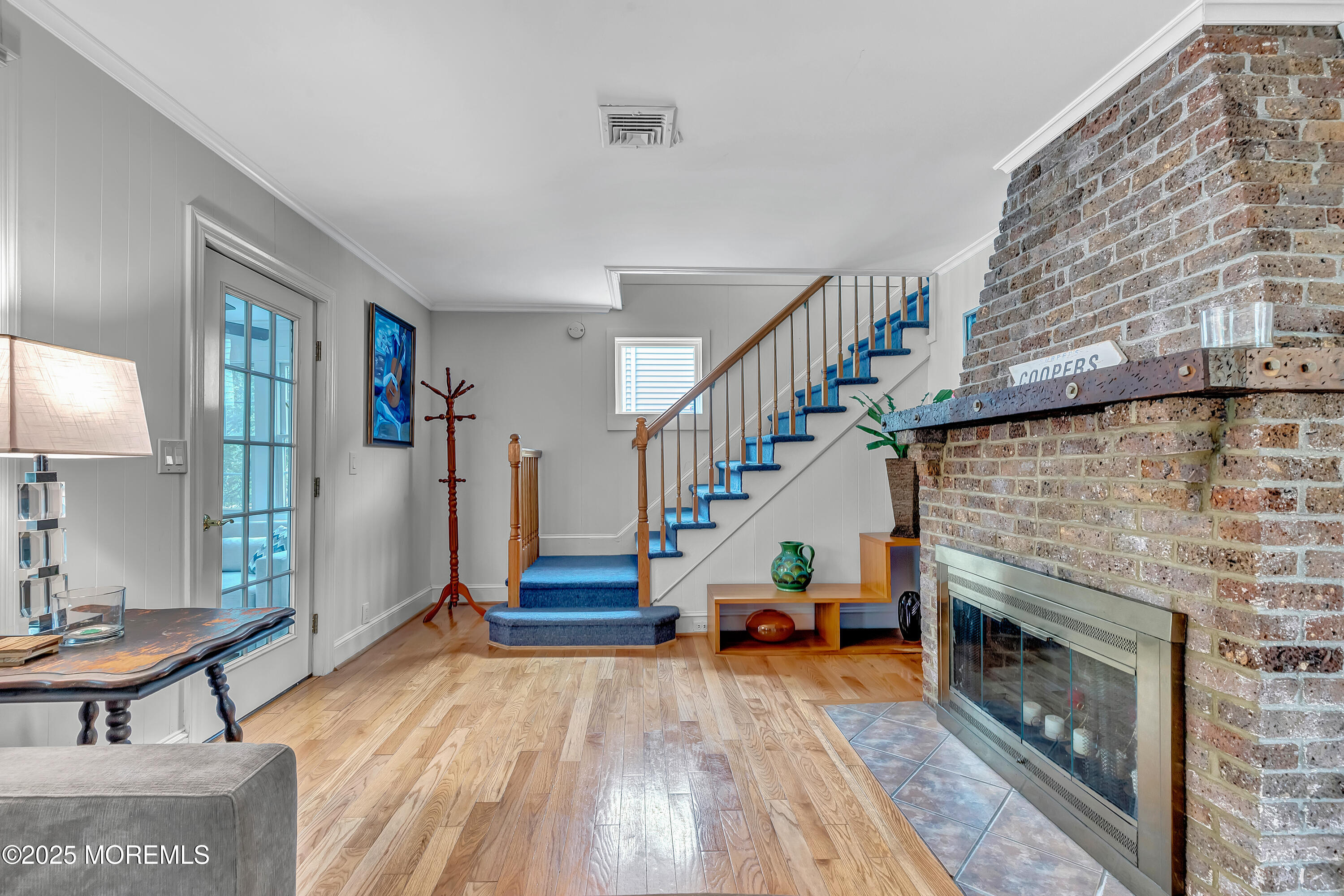 370 East Main Street Manasquan, NJ 08736 - Photo 6 of 34 a living room with stairs and a fireplace
