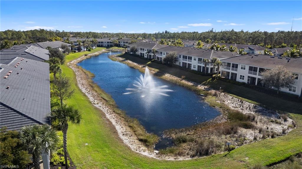 6934 Avalon Circle, Unit 405 Naples, FL 34112 - Photo 15 of 16 Drone / aerial view of a nearby body of water