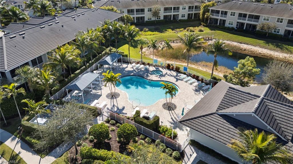 6934 Avalon Circle, Unit 405 Naples, FL 34112 - Photo 16 of 16 Aerial view of a large body of water and a pool