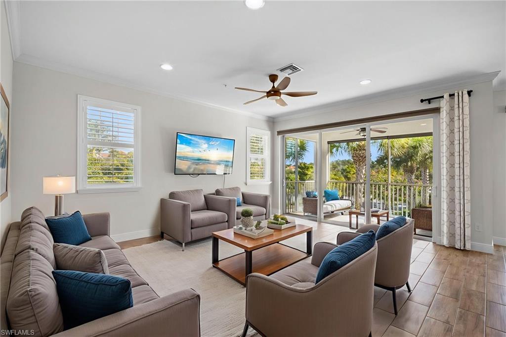 6934 Avalon Circle, Unit 405 Naples, FL 34112 - Photo 2 of 16 Living area featuring crown molding, wood finish floors, ceiling fan, and recessed lighting