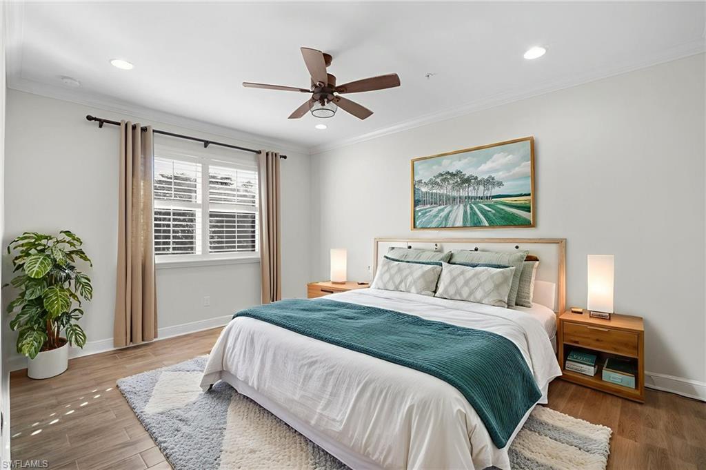6934 Avalon Circle, Unit 405 Naples, FL 34112 - Photo 5 of 16 Bedroom with crown molding, wood finished floors, a ceiling fan, and recessed lighting