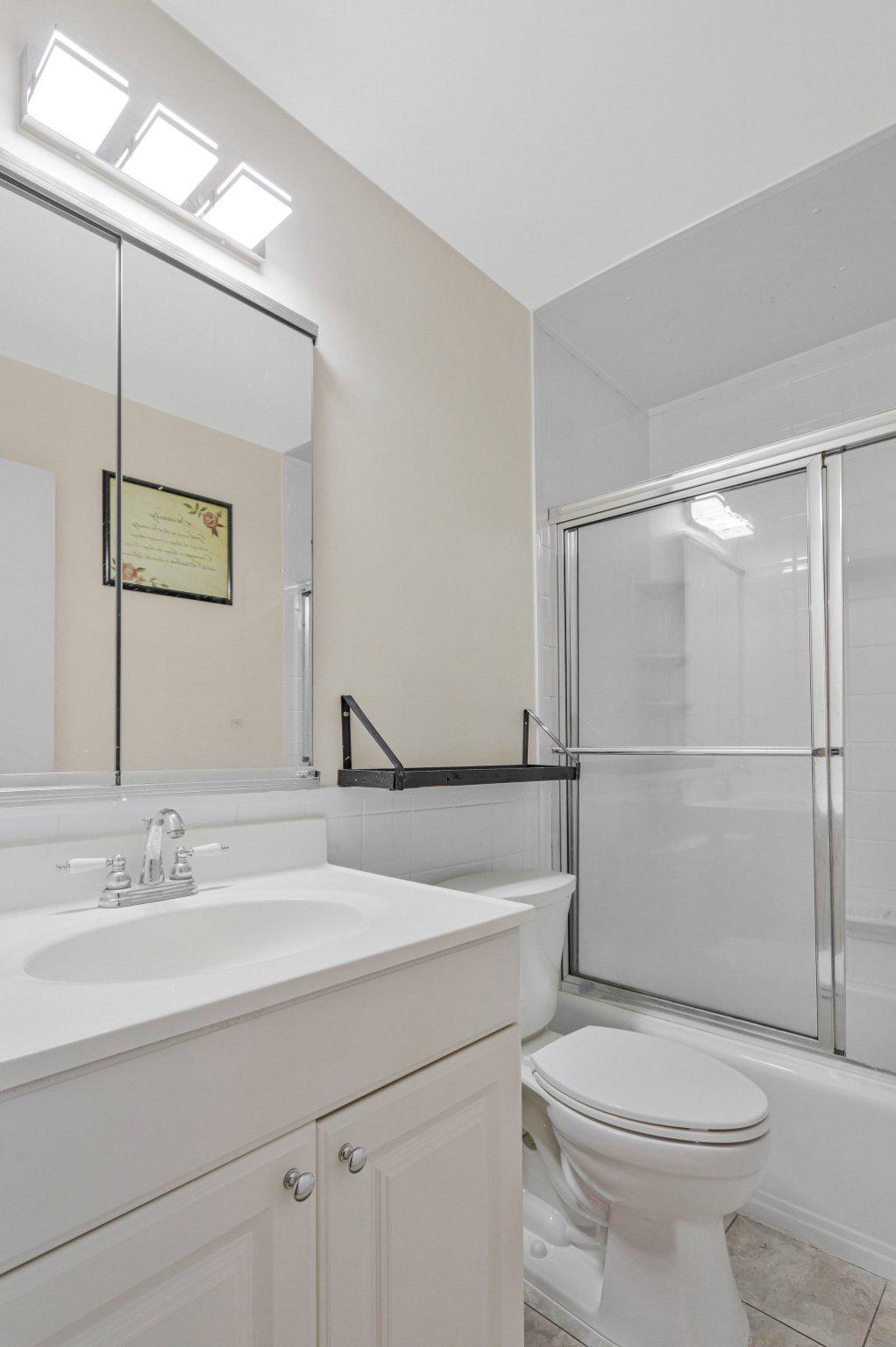 1675 Ridgely Court, Unit 182 Crofton, MD 21114 - Photo 36 of 47 a bathroom with a sink toilet and shower
