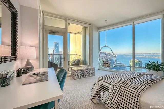 a bathroom with a shower a mirror a sink and a shower